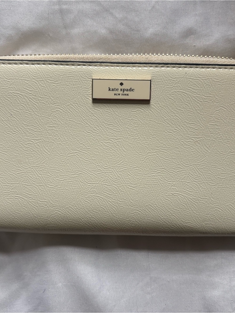 kate spade Cream Textured Leather Wristlet Clutch